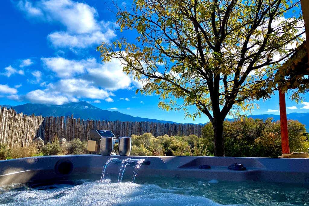 Step into a peaceful Taos retreat surrounded by sweeping mountain and valley views, where quiet mornings, glowing sunsets, and starlit evenings create the perfect backdrop for slowing down and settling in. Casa Nido blends warm Southwestern charm with thoughtfully designed indoor and outdoor spaces, offering a private escape just minutes from Taos Plaza. From relaxing in the hot tub beneath the stars to gathering around the chimenea after a day of exploring Northern New Mexico, this home feels both inspiring and deeply comfortable from the moment you arrive.  