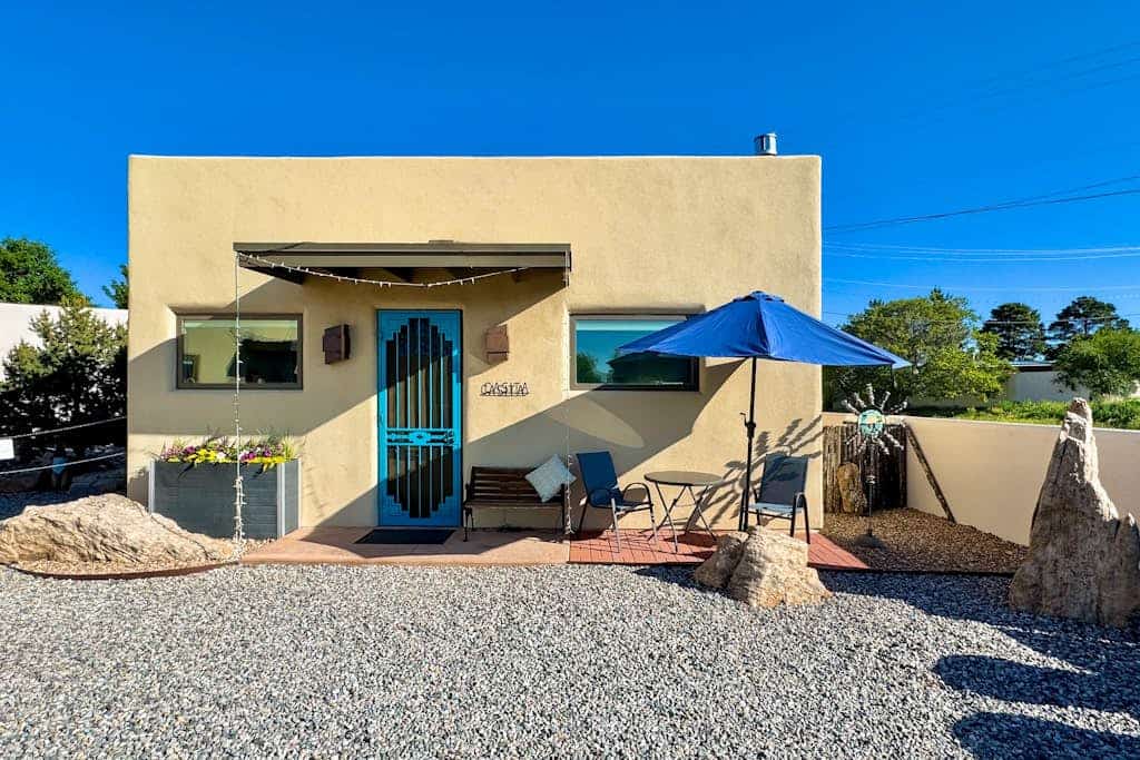 Wake up in the heart of Santa Fe and enjoy a walkable stay just moments from the historic Plaza. Spend your days exploring galleries, shops, restaurants, and cultural landmarks, then return home to unwind beside the traditional gas kiva fireplace or enjoy the private patio with outdoor dining and lighting. With a front bistro seating area, single level layout, fully equipped kitchen, Wi Fi, and in home washer and dryer, this Santa Fe retreat offers an easy, comfortable, and central stay.