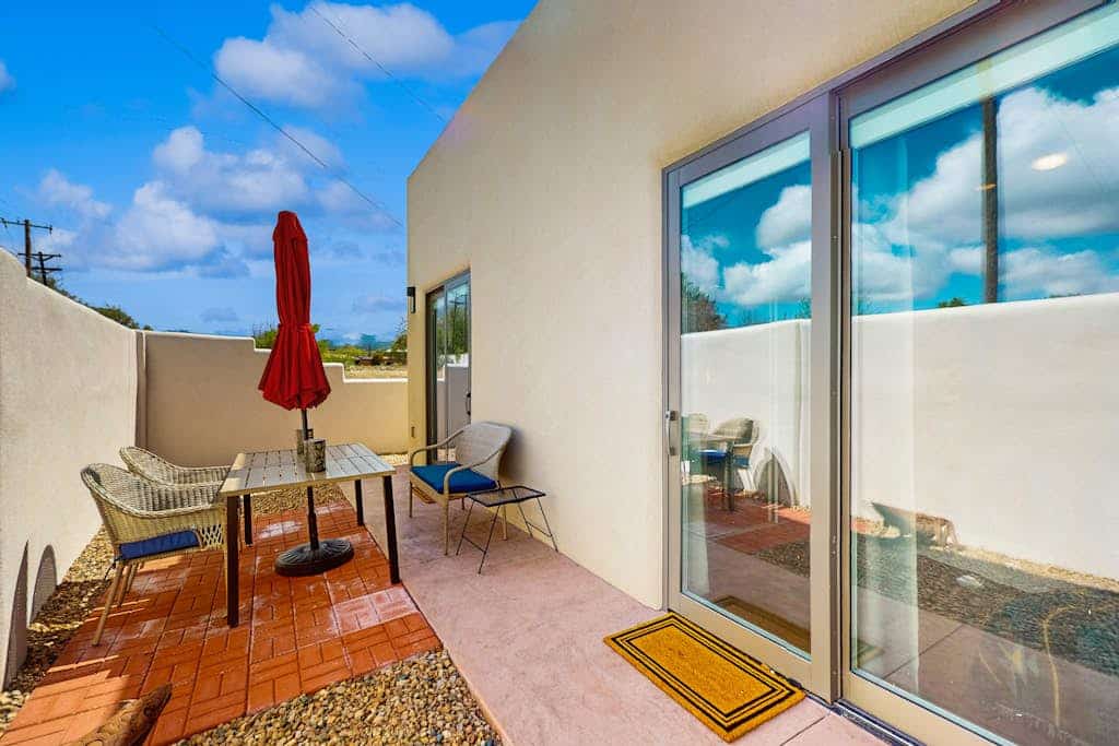 Wake up in the heart of Santa Fe and enjoy a walkable stay just moments from the historic Plaza. Spend your days exploring galleries, shops, restaurants, and cultural landmarks, then return home to unwind beside the traditional gas kiva fireplace or enjoy the private patio with outdoor dining and lighting. With a front bistro seating area, single level layout, fully equipped kitchen, Wi Fi, and in home washer and dryer, this Santa Fe retreat offers an easy, comfortable, and central stay.