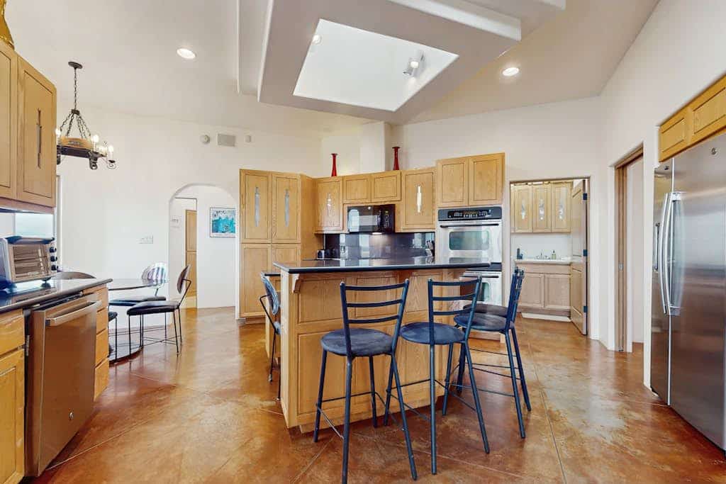 Wake up to sweeping desert views at this adobe-style retreat in Rancho de Taos, where privacy, space, and luxury come together inside the gated Taos Country Club community. Spend your days skiing Taos Ski Valley, golfing at sunrise, or exploring Santa Fe’s art and dining scene, then return home to unwind in the hot tub under star-filled skies. With a sauna, game room, firepit, and expansive indoor-outdoor living, this is a true Southwest escape designed for connection, comfort, and unforgettable stays.
