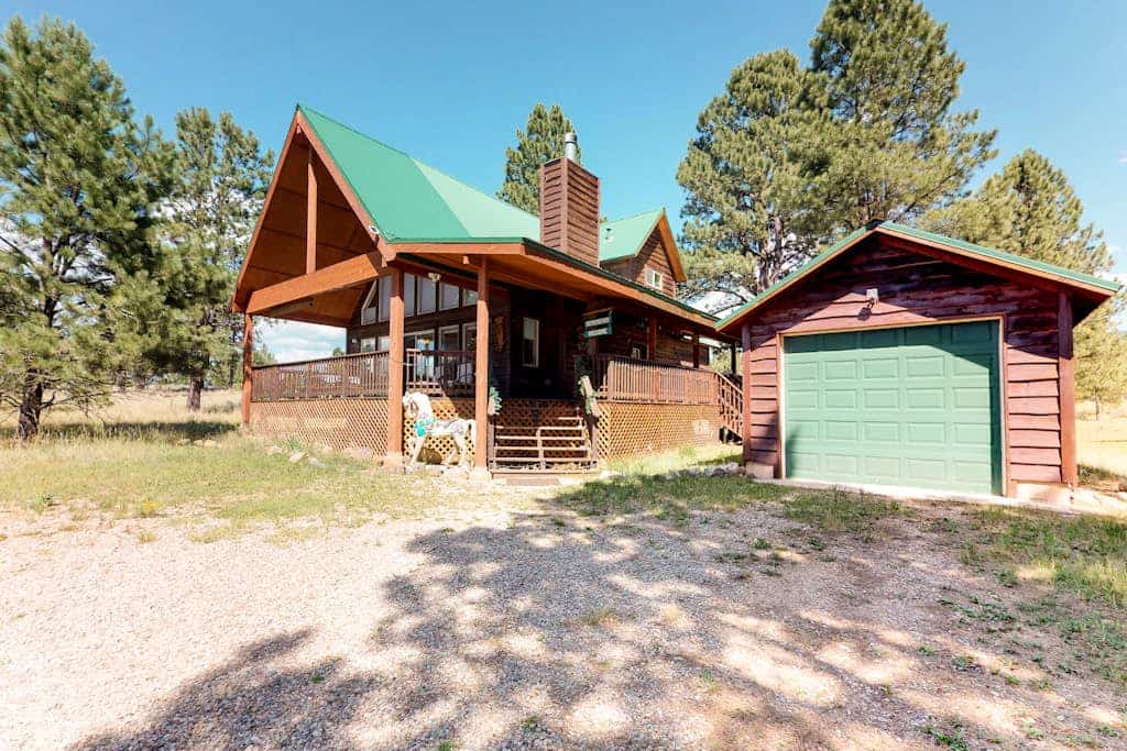 Welcome to Painted Pony Cabin, a charming log retreat tucked among tall pines on a peaceful stretch of Angel Fire. Gather in the soaring great room by the fireplace, cook together in the full kitchen, and spill out onto the wraparound deck to grill, sip coffee, and watch for deer and elk. With three bedrooms, a cozy loft, and the slopes just over a mile away, it is your year-round basecamp for mountain adventure and slow, restful mornings.