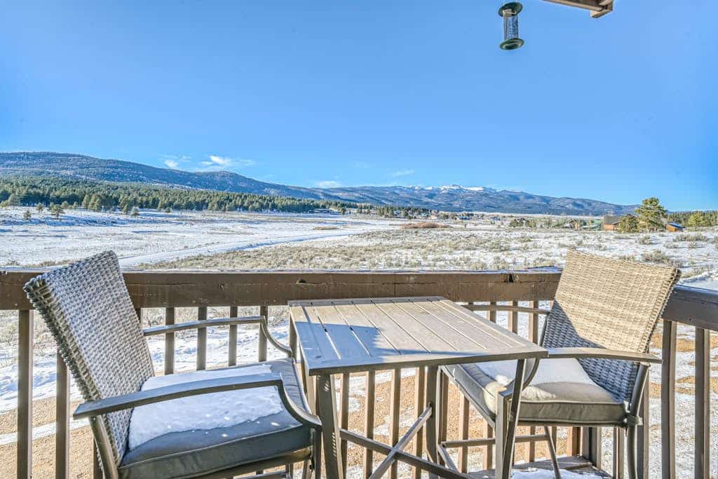 Welcome to Mountain Meadows Views, a bright, updated Angel Fire condo with big mountain, valley, and meadow views right from the private balcony. Sip morning coffee while you watch wildlife in the meadow, cozy up by the fireplace after a day on the slopes, and cook in the full kitchen with a breakfast bar for four. With a king bedroom, a sofa bed, and two full baths, it is a comfortable, single-level base year-round, and you are right on the ski shuttle route.