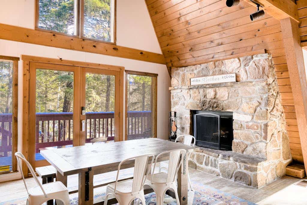 Welcome to your dream A-frame retreat, tucked away in the mountains of Northern New Mexico. Surrounded by towering trees and visiting wildlife, this spacious home is the ultimate base for exploring Angel Fire Resort and beyond. After a day of skiing or hiking, come home to challenge friends to a game of foosball, gather by the stone fireplace, or watch the sunset from the wrap-around balcony. It’s the perfect mountain escape for families and groups looking to reconnect in nature.