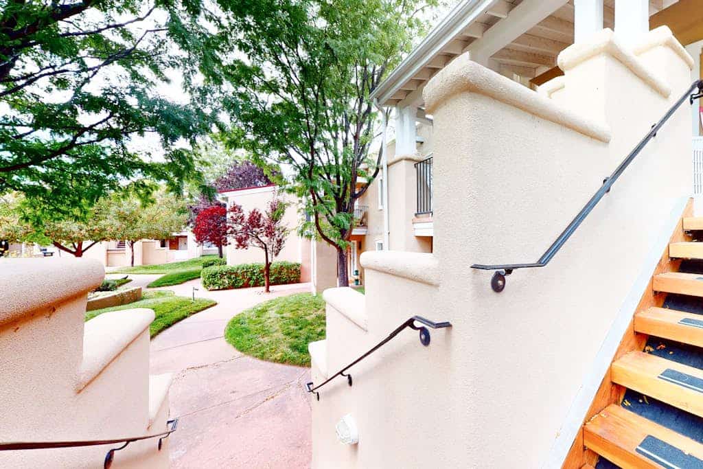This charming, newly renovated and remodeled condo is located in El Matador, a quiet gated community adorned with mature trees. Filled with art and a cozy ambiance, the home features a beautiful library stocked with over 100 books covering the cuisine, art, and history of New Mexico. Enjoy the warm glow of the gas fireplace or step outside onto the second floor landing to sip your morning coffee. Located just blocks from Artist Road, you can walk to downtown shops or take a short drive straight up to Ski Santa Fe.