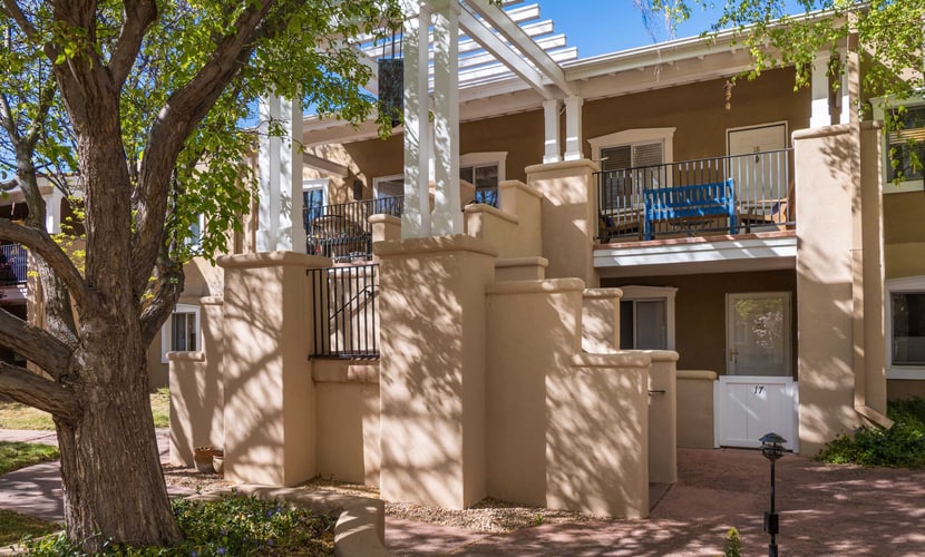 This charming, newly renovated and remodeled condo is located in El Matador, a quiet gated community adorned with mature trees. Filled with art and a cozy ambiance, the home features a beautiful library stocked with over 100 books covering the cuisine, art, and history of New Mexico. Enjoy the warm glow of the gas fireplace or step outside onto the second floor landing to sip your morning coffee. Located just blocks from Artist Road, you can walk to downtown shops or take a short drive straight up to Ski Santa Fe.
