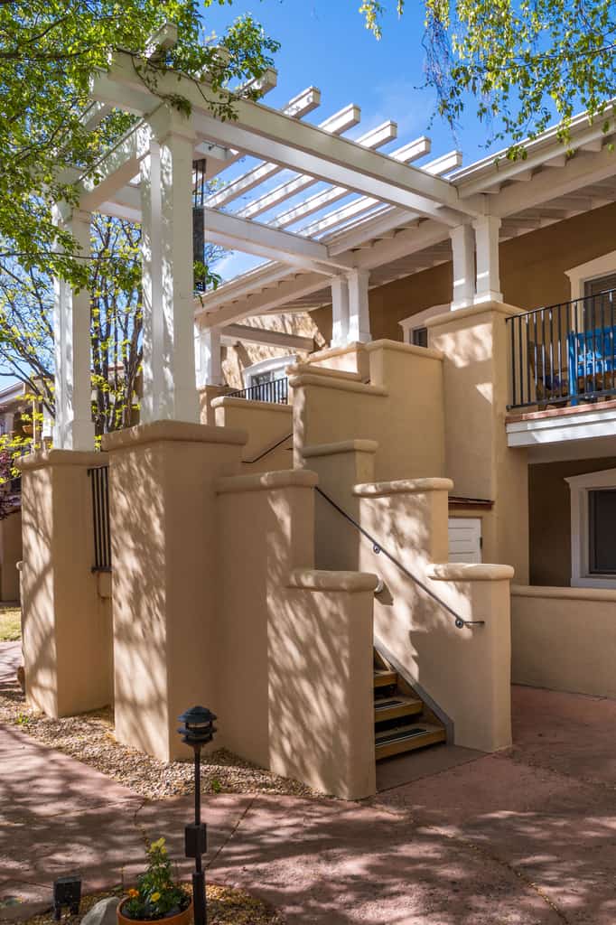 This charming, newly renovated and remodeled condo is located in El Matador, a quiet gated community adorned with mature trees. Filled with art and a cozy ambiance, the home features a beautiful library stocked with over 100 books covering the cuisine, art, and history of New Mexico. Enjoy the warm glow of the gas fireplace or step outside onto the second floor landing to sip your morning coffee. Located just blocks from Artist Road, you can walk to downtown shops or take a short drive straight up to Ski Santa Fe.