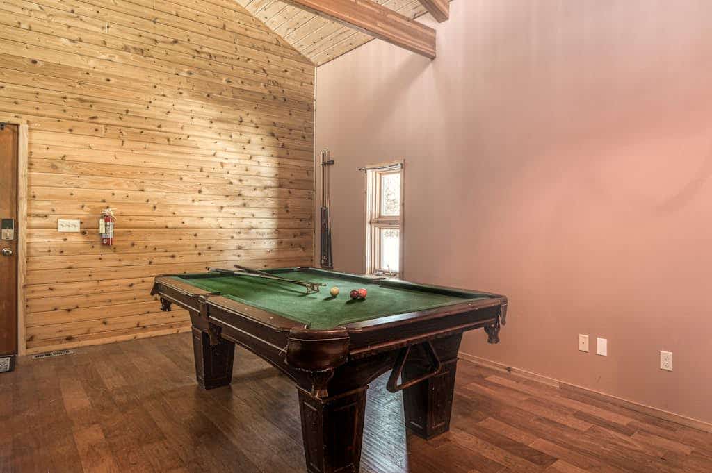 If you're planning the perfect family escape, look no further than this darling Angel Fire cabin featuring a private hot tub! Wait for it Getaway is made for gathering and making memories, offering 2 bedrooms plus a sunlit loft, a full-size pool table, and a wraparound deck for viewing local wildlife. It is the kind of mountain getaway that feels easy, memorable, and hard to leave.