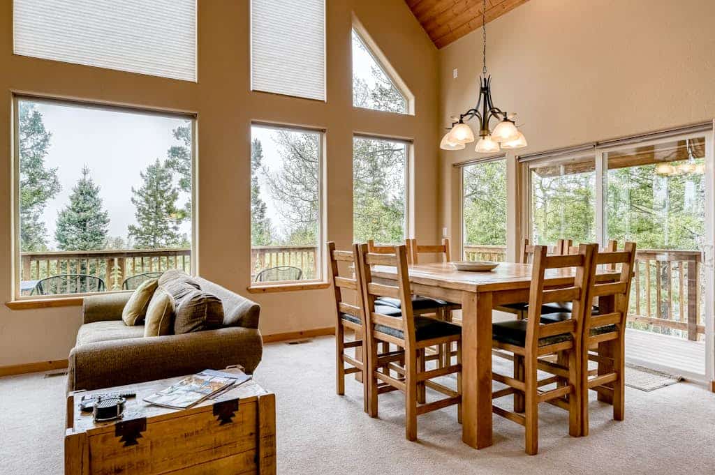Welcome to Morada Mirasol, your home away from home in beautiful Angel Fire. Surrounded by mountain views, this spacious ski-in/ski-out (seasonal) retreat is designed for families and groups looking to relax, reconnect, and enjoy the outdoors, with a game room, a cozy fireplace, and a wraparound deck for taking in the scenery.