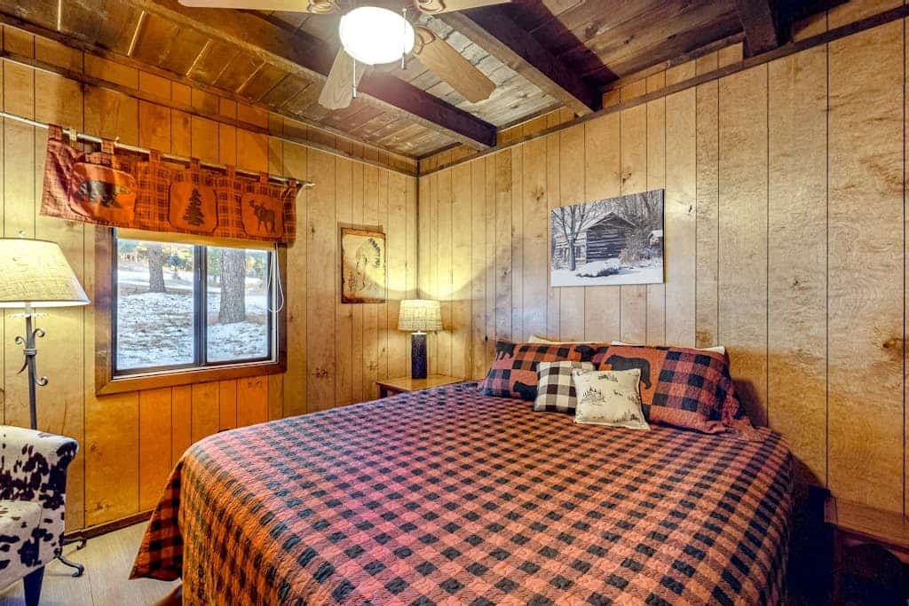 Welcome to Casa Buena Vista, a warm chalet-style cabin tucked among the pines of Angel Fire. A soaring vaulted great room with a stone wood-burning stove and walls of windows invites your group to gather after a day outdoors. Two king bedrooms plus an open loft sleep eight, and the wraparound deck with a gas grill is made for slow mountain mornings. Bring the dog and settle in for ski days, summer hikes, or a quiet reset in the trees.