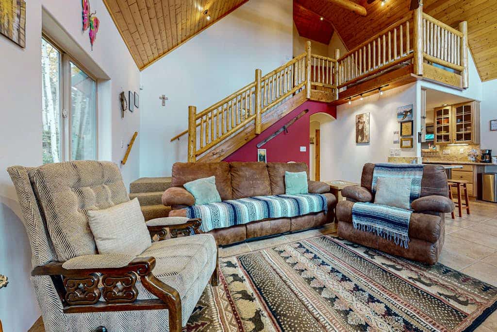 Escape to the serene beauty of Angel Fire, New Mexico, and stay in this charming cabin that offers the perfect blend of comfort and adventure. Nestled in a picturesque setting, this cabin is equipped with all the amenities you need for a relaxing getaway. From the wood burning fireplace to the jetted tub, every detail has been carefully considered to ensure a cozy and enjoyable stay.

Step outside onto the deck or balcony to take in the fresh mountain air and stunning views. Whether you are grilling on the gas grill, relaxing on the patio furniture, or stargazing at night, the outdoor spaces provide the ideal setting for unwinding after a day of exploring the area.