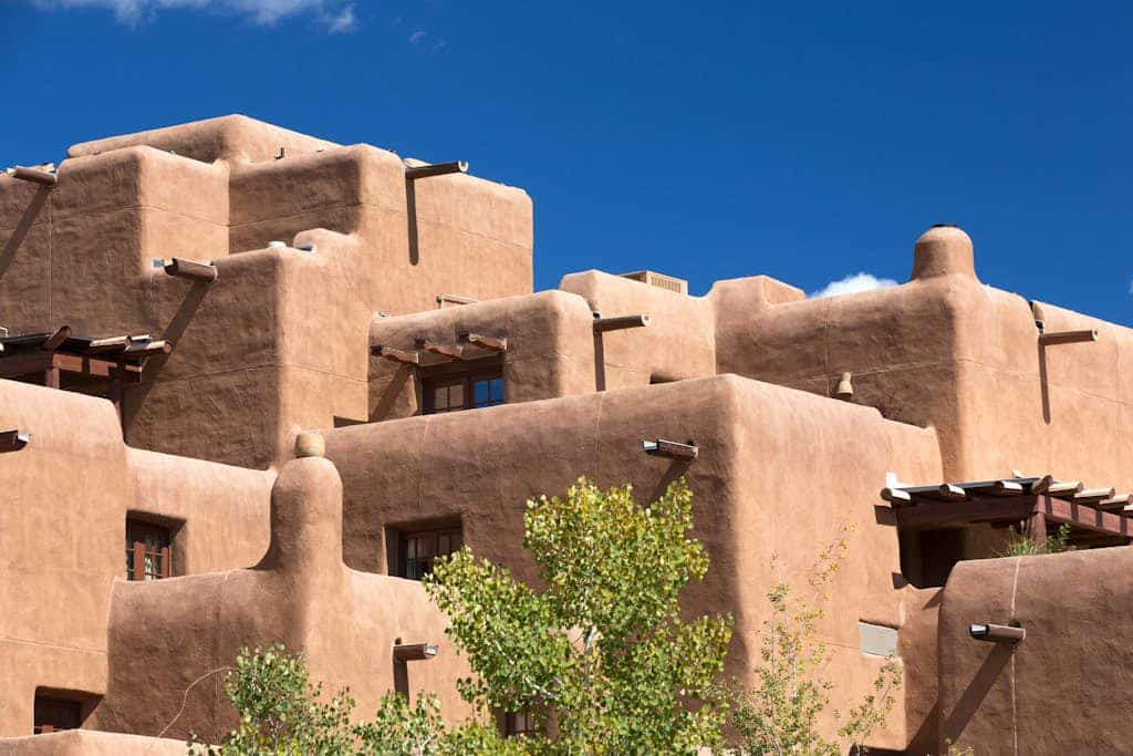 Step into a charming historic adobe casita in the heart of Santa Fe’s desirable Eastside. Casa De Lorena blends authentic Southwestern character with modern comfort, featuring a wood-burning kiva fireplace, traditional vigas ceilings, colorful Mexican tile, and a peaceful private garden patio. With 1 bedroom and space for up to 3 guests, this cozy retreat is perfect for couples, solo travelers, or small groups looking to explore Santa Fe on foot, just minutes from Canyon Road galleries, downtown shops, and the historic Plaza.