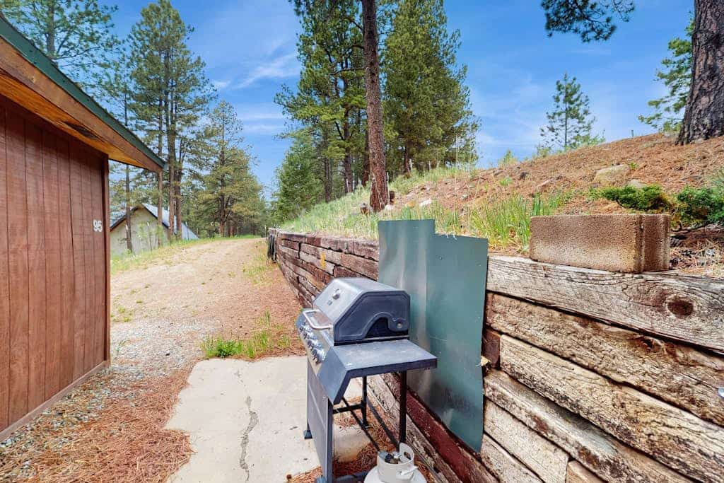 Welcome to Bigfoot Lodge, a rustic wood cabin tucked among tall pines just minutes from Angel Fire. With 2 bedrooms, room for 6, three covered decks, and big mountain and valley views, it is made for summer in the mountains. Spend your days hiking, biking, fishing, and exploring, then gather on the deck in the alpine air or around the wood-burning fireplace. Dogs are welcome, too.