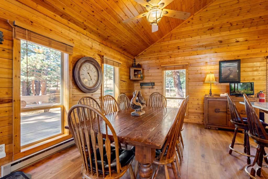 Reconnect at this rustic mountain retreat on a spacious corner lot surrounded by pines. Located less than a mile from Monte Verde Lake, this home is designed for large groups to recharge. After a day of golf or kayaking, relax on the heated front deck, enjoy the wet bar, or gather around the massive rock fireplace. With 5 bedrooms, 4 bathrooms, and a private swing set for kids, it’s the ultimate basecamp for year-round family adventures in Angel Fire.