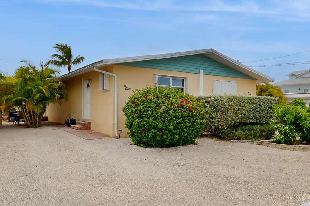 Dog-friendly waterfront home with dock, pool, gas grill, & beach access
