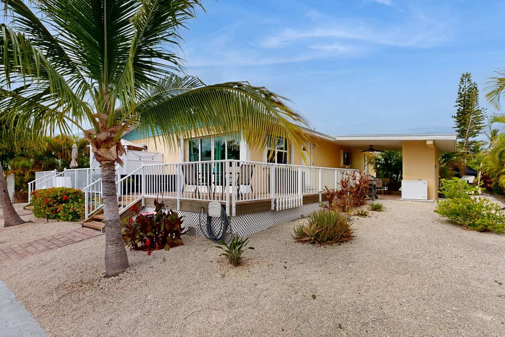 Dog-friendly waterfront home with dock, pool, gas grill, & beach access