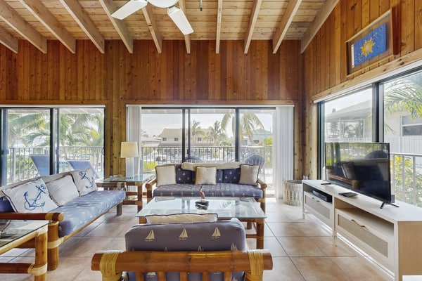 Charming canal-front home with 37-ft dock, kayaks, grill, patio & club access