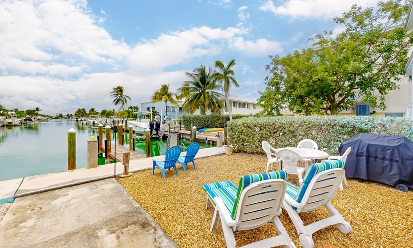 Canal-front home with Cabana Club access, water view, & private W/D