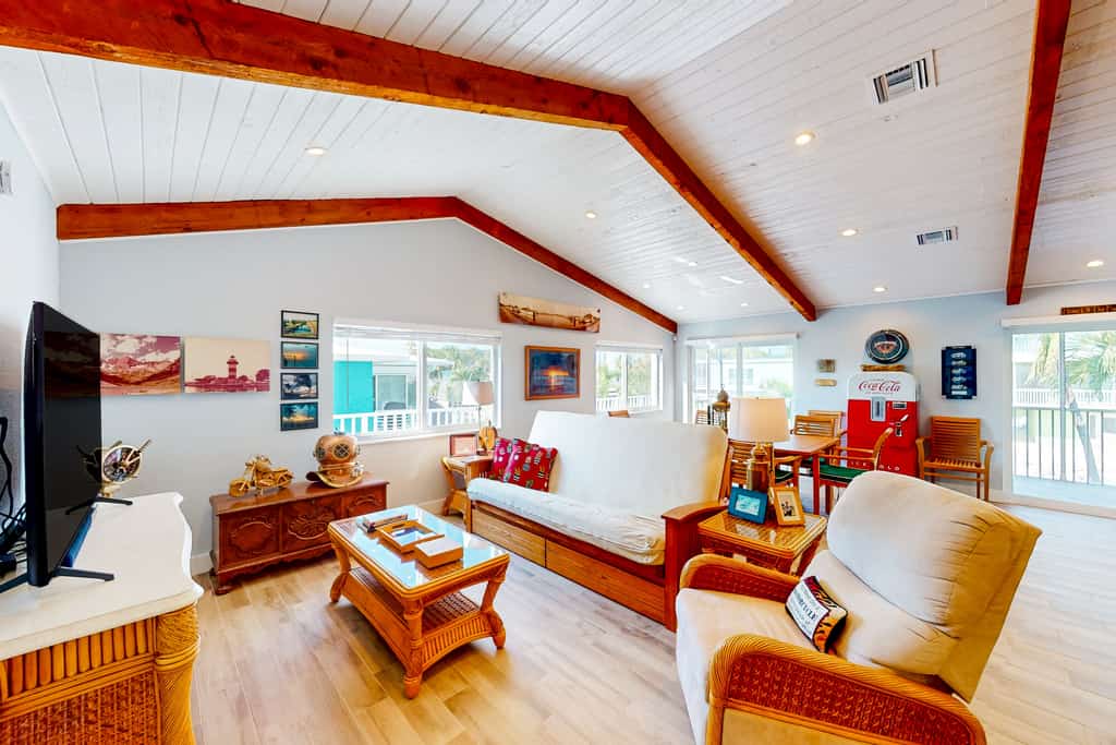 Radiant waterfront retreat with remarkable views, patio, tennis court, & grill