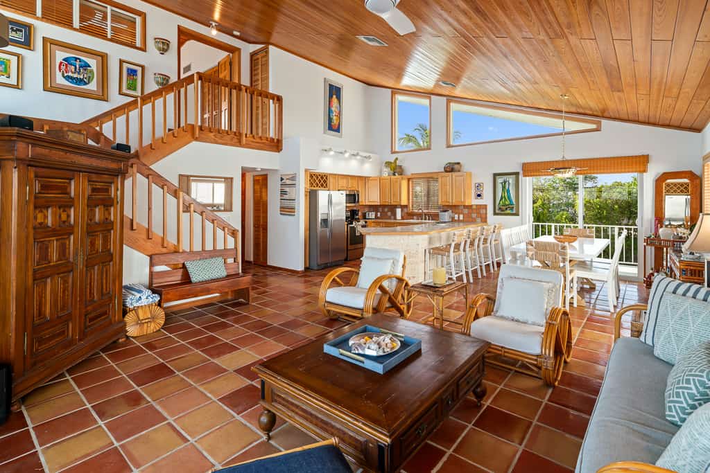 Oceanfront home with a pool, dock, grill, scenic balconies, games, W/D, & AC