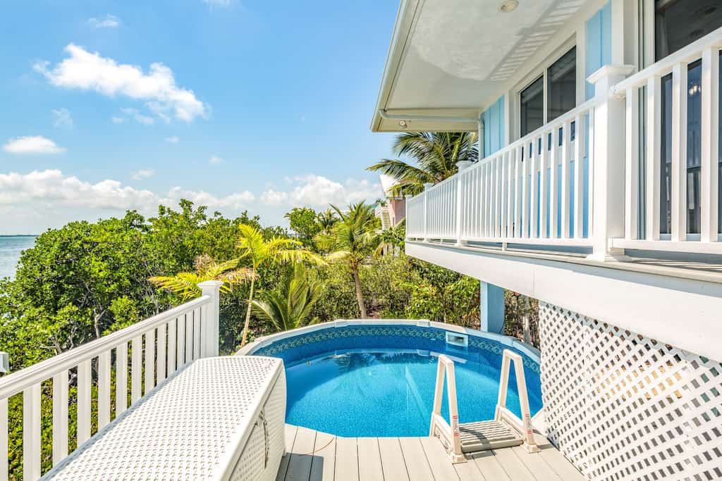 Amazing waterfront home with private beach, dock, pool, WiFi & outdoor kitchen