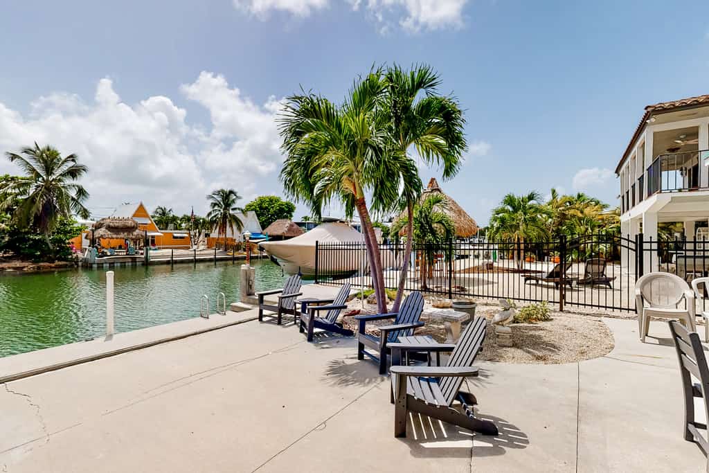 Waterfront home with 60-foot dock & beautiful patio - walk to beach