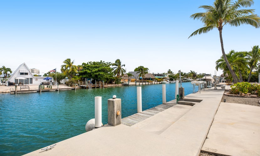 Waterfront home with 60-ft dock, pool, & cabana club access - dog-friendly