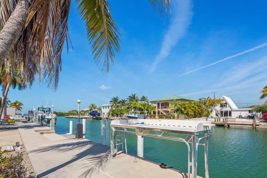 Waterfront home with 60-ft dock, pool, & cabana club access - dog-friendly