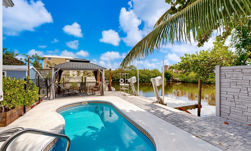 Florida Keys style waterfront home w/ private pool, modern decor and prime location