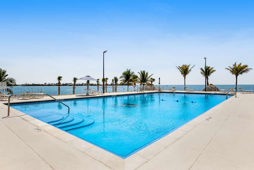 Modern waterfront condo with pool, shared dock - snowbird-friendly