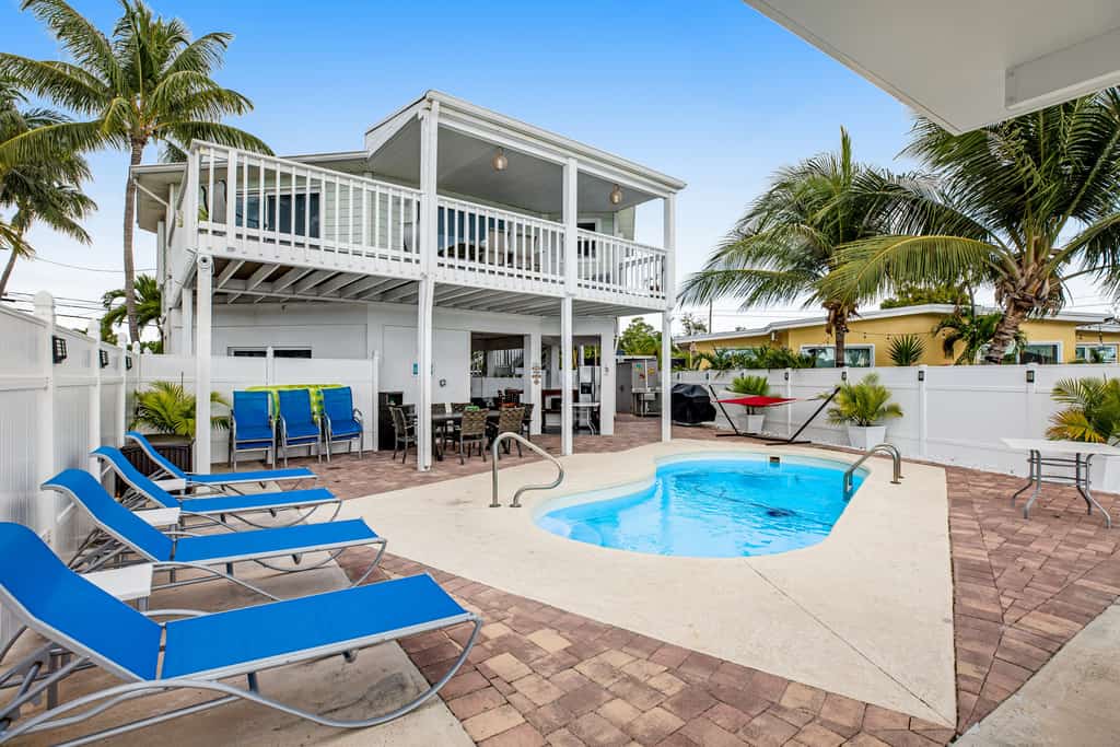 Waterfront home with dock, pool table & private pool - walk to Sombrero Beach