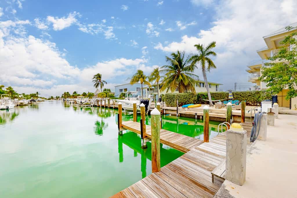 Canal-front duplex with Cabana Club membership, private dock, canal views, grill