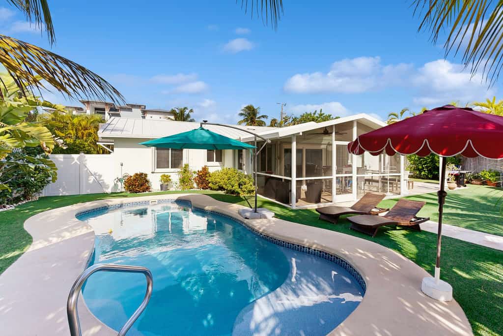 Quiet, spacious canal-side home with private pool, waterfront patio & central AC