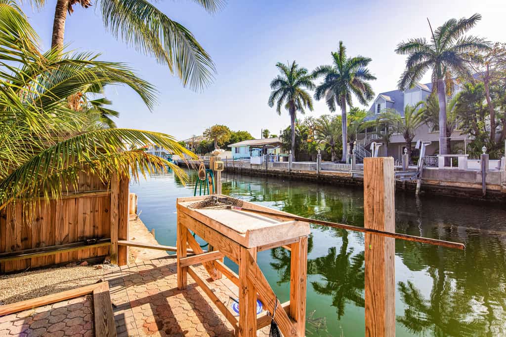 Waterfront house with covered patio, private pool, & 75' dock - dogs welcome