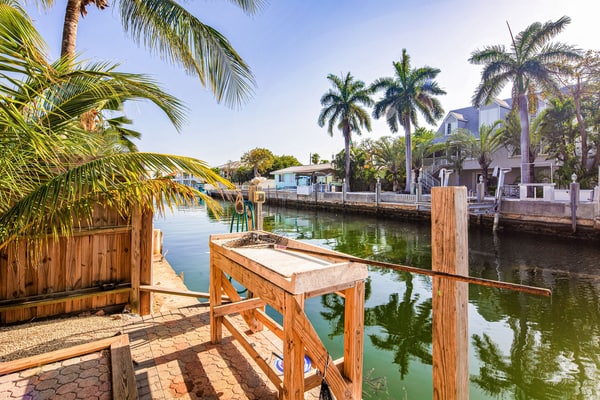 Waterfront house with covered patio, private pool, & 75' dock - dogs welcome