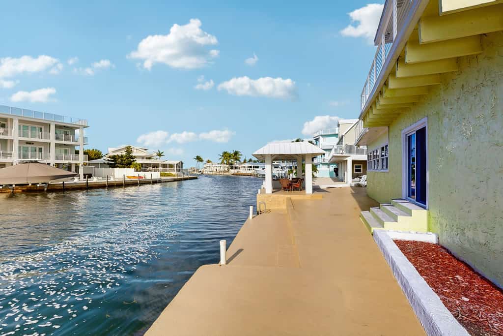Canal Front Gem W/ Private Dock, PS4, Free WiFi, & Expansive Balcony W/ Views