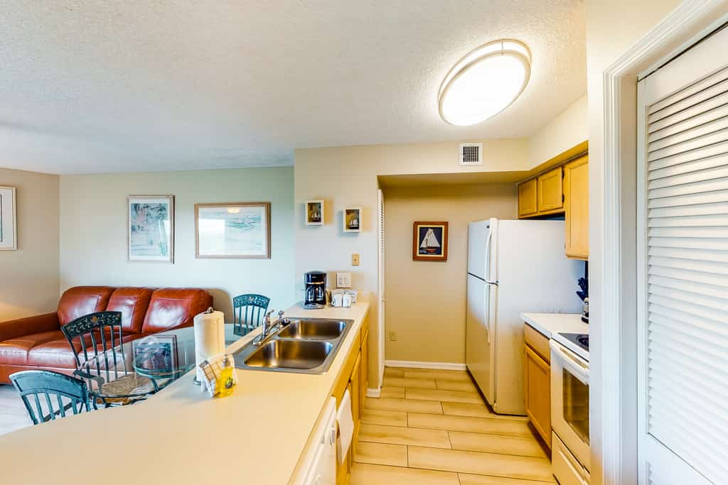 Coastal retreat with private balcony, pool, & easy beach access