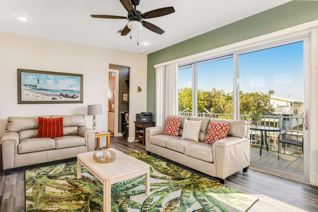 Beautiful waterfront home with central AC, dock, lovely balcony & patio