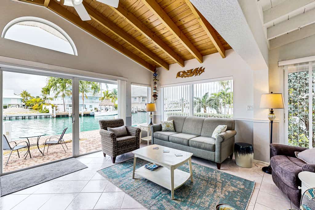 Waterfront Home with 35-Foot Dock and Access to Private Beach and Shared Pool