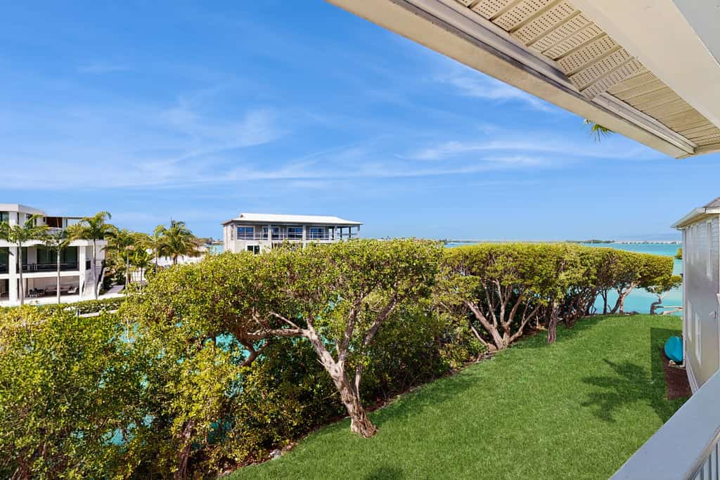 Charming townhome with ocean views, an open porch & steps from the water