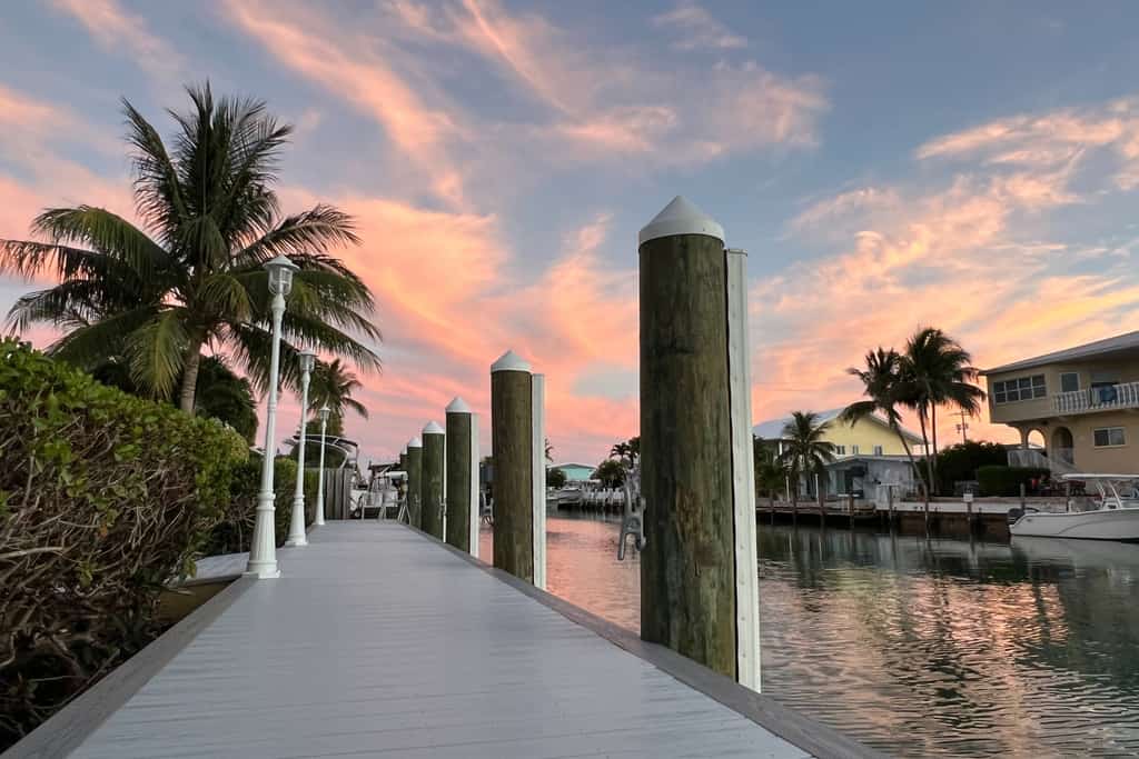 Waterfront duplex with hot tub, pool, & beach access - W/D, balcony, and grill
