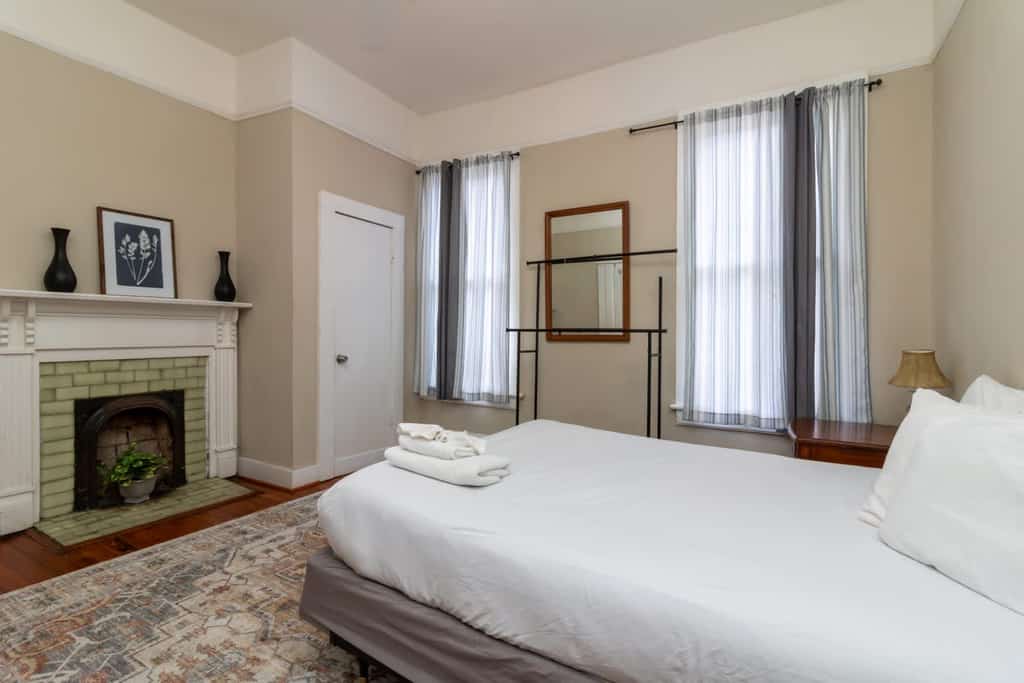 This secret getaway is the back unit of a duplex and is nestled in the center of Columbus but secluded from hustle and bustle of downtown. Relax on the back porch, or soak up the natural light flooding the inside of the apartment. It is only a short walk from downtown and 15 minutes to Fort Moore. If traveling with a larger group, you can rent both halves of the house! The fireplaces no longer work, but they add to the historic character of this great home!