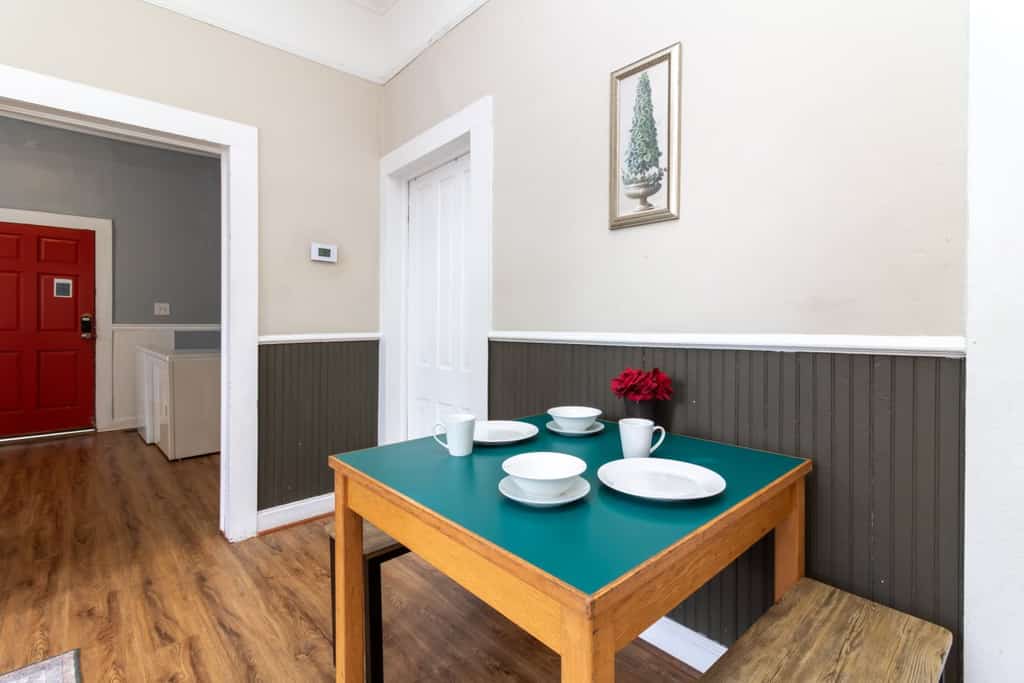 This secret getaway is the back unit of a duplex and is nestled in the center of Columbus but secluded from hustle and bustle of downtown. Relax on the back porch, or soak up the natural light flooding the inside of the apartment. It is only a short walk from downtown and 15 minutes to Fort Moore. If traveling with a larger group, you can rent both halves of the house! The fireplaces no longer work, but they add to the historic character of this great home!