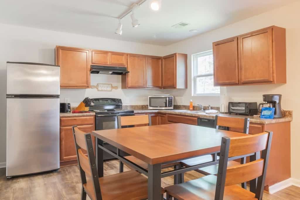 This brand new 4-bedroom/2.5-bathroom home offers an open-concept living space downstairs with a fully-equipped kitchen, dining room, living room, and half bath! The 4 bedrooms and 2 full bathrooms are upstairs. Only 10 minutes to Fort Benning (Moore) and 15 minutes to downtown Columbus! Onsite laundry, off street parking, free wifi, and pets are welcome with a fee! We would love to host you!