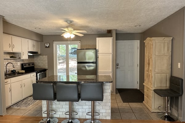Humble Hideaway - Inviting lakefront home with firepit, balcony & W/D - dog-friendly