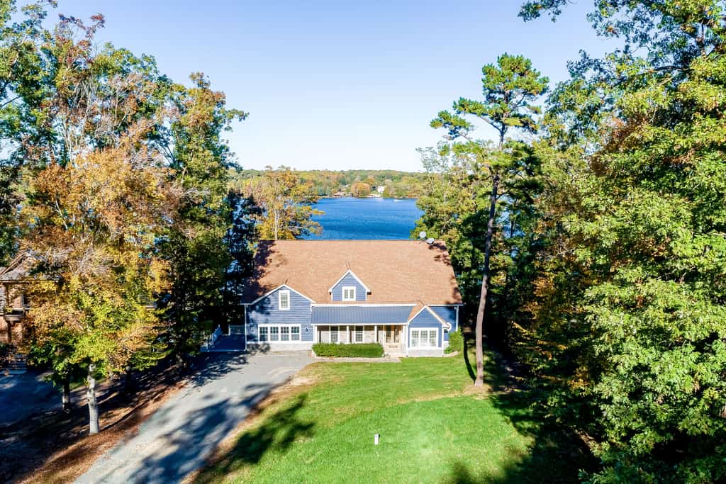 Lakefront home with private hot tub, WiFi, fun rec room, & beach area