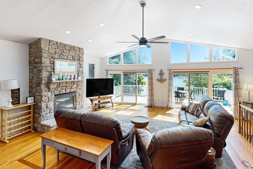 Lakefront home with two kitchens, a dock, firepit