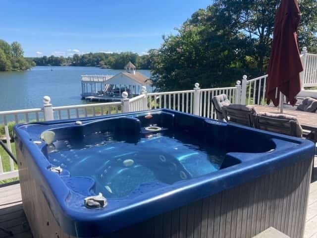 Lakefront retreat with views, hot tub, kid's play area, dock & fiber internet