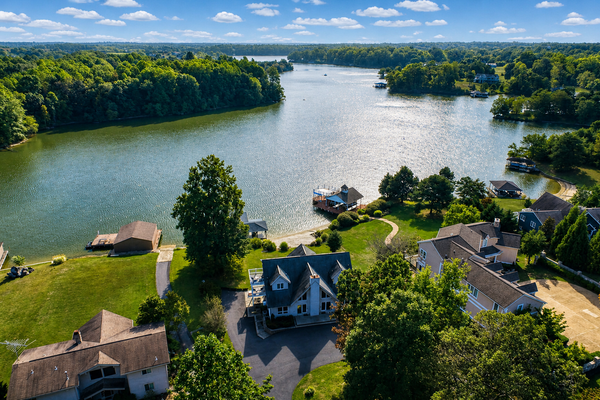 Lakefront retreat with views, hot tub, kid's play area, dock & fiber internet