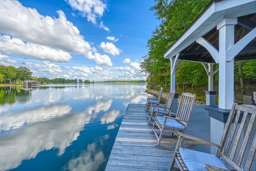 Stunning lakeside home with dock, large deck, kayaks, firepit, & pool table