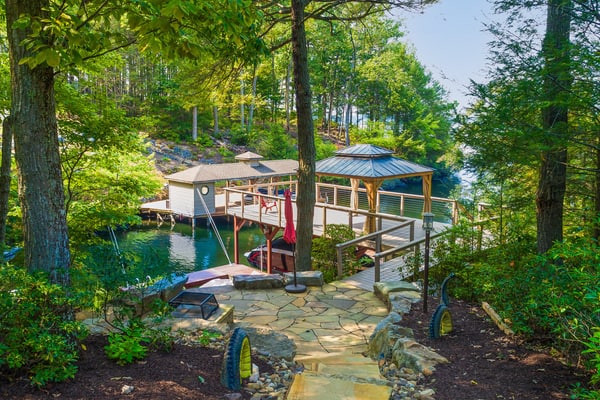 Lakefront home with luxurious finishes, granite counters, fireplace, lake views, foosball & dock